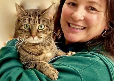 Woman Posing With Green Eyed Cat