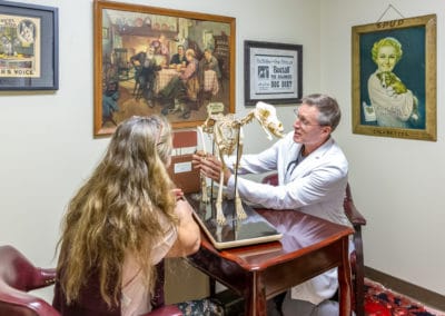 Dr. Rowan Explaining Surgical Procedure Using Dog Skeleton