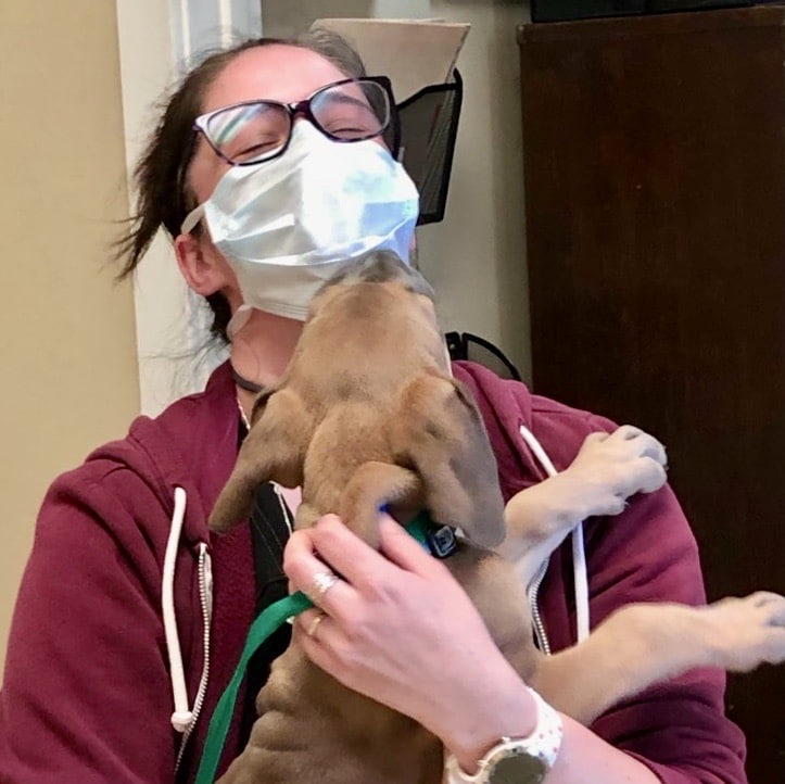 Receptionist Teresa with a New Puppy